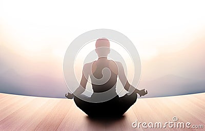 Woman was meditating in morning and rays of light on landscape Stock Photo