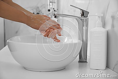 Woman washing hands with antibacterial soap indoors, closeup. Personal hygiene during COVID-19 pandemic Stock Photo