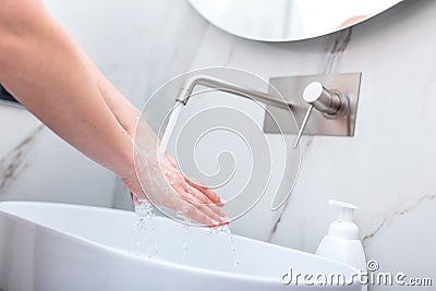 Woman washing hands with foam soap. Hygiene, preventing coronavirus Stock Photo