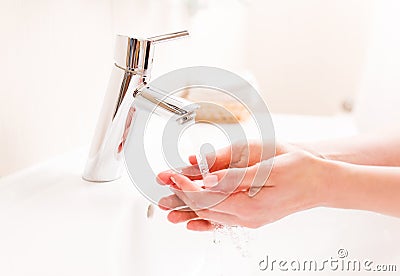 Woman washing your hands Stock Photo