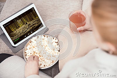 Woman watches some viedo on her tablet Stock Photo