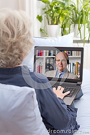 Woman watching english language lesson Stock Photo