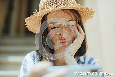 Woman watching an online movie on her phone Stock Photo