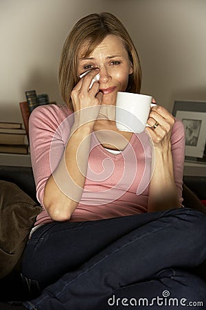 Woman Watching Sad Film On Television Stock Photo