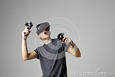 Woman Watching Television Wearing Virtual Reality Headset Stock Photo