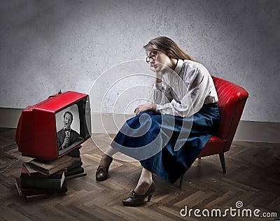 Woman watching tv Stock Photo