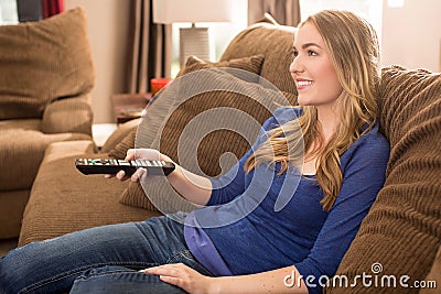 Woman watching tv Stock Photo