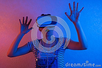 Woman watching with VR with red and blue light Stock Photo