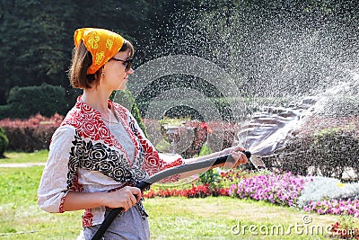 Woman watering the flowers Stock Photo