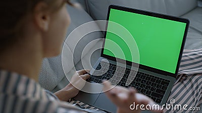 Woman waving green laptop at home closeup. Student videocalling family weekend Stock Photo