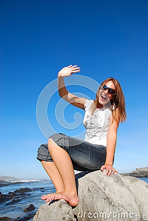 Woman waving hand Stock Photo