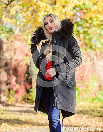 Woman wear black parka fur hood. Classic parka coat has become wardrobe icon. Versatile functional and stylish. Girl Stock Photo