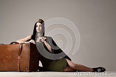 Woman wear fashion military cloth dress dark green hat uniform on day of victory May 9 Russia Stock Photo