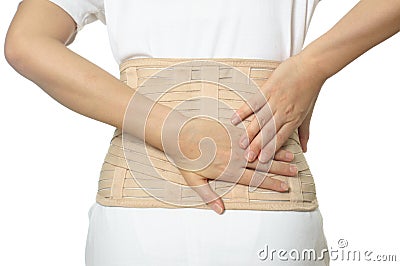 Woman wearing back support belt Stock Photo