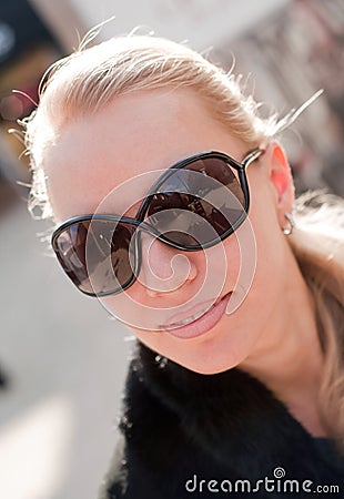 Woman wearing the big modern sunglasses. Stock Photo