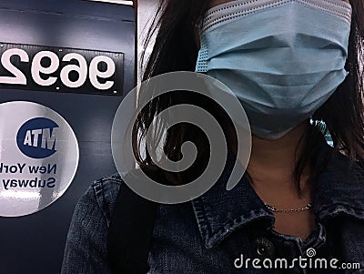 Woman Wearing Blue Face Mask on New York Subway Train Commute NYC Editorial Stock Photo