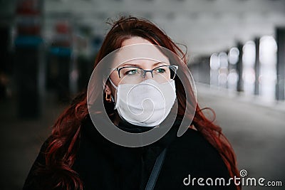 Woman wearing face mask because of Air pollution or virus epidemic in the city Stock Photo