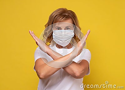 Woman wearing face protection in prevention for coronavirus showing gesture Stop Infection Stock Photo