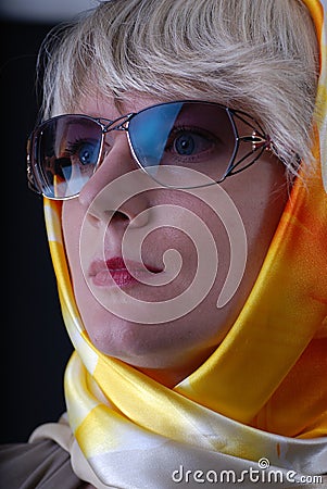 Woman wearing glasses and neckerchief Stock Photo