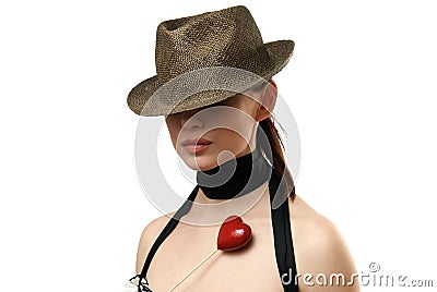 Woman wearing hat showing heart shaped cookie Stock Photo