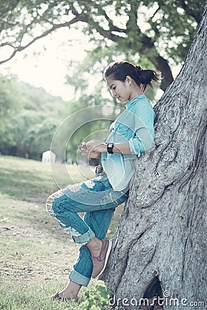 Woman wearing jeans and a denim jacket. She relax in the holida Stock Photo