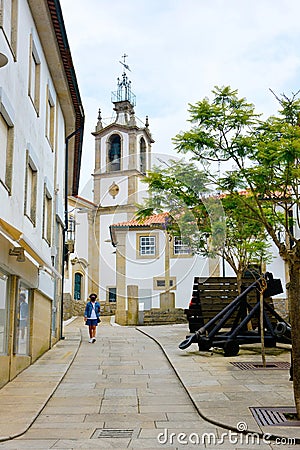 Woman Wearing Mask and Walking on Empty Street, Old Town Castle, Valenca, Portugal Editorial Stock Photo