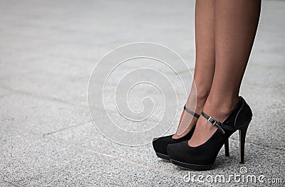 Woman wearing a pair of black classic high heels Stock Photo