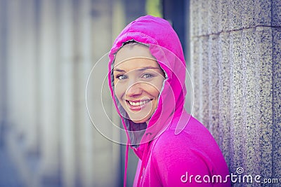 A woman wearing a pink jacket Stock Photo