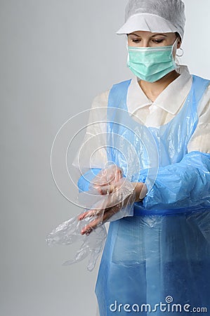 Woman wearing plastic gloves Stock Photo