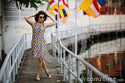 Woman wearing sunglasses on the river embankment Stock Photo