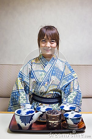 Woman wearing traditional japanese yukata or kimono make a tea Stock Photo