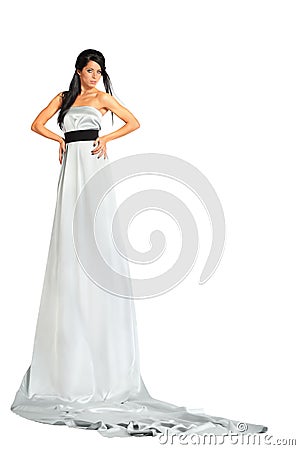 Woman wearing very long silver dress stands Stock Photo