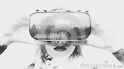 Woman wearing virtual reality glasses. VR headset. Double exposure virtual reality concept. Stock Photo