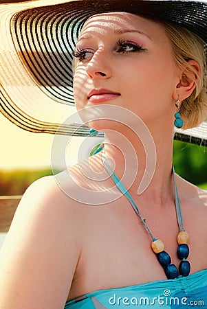 woman wearing white dress and straw hat Stock Photo