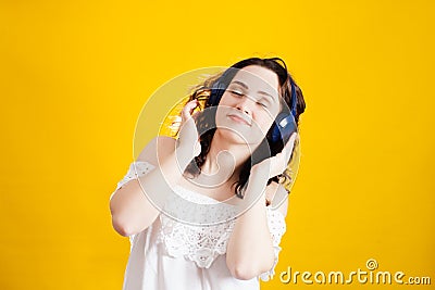 Woman wearing wireless headphones Stock Photo