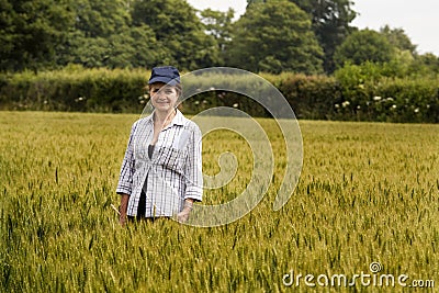 Woman in Wheat Field Stock Photo