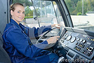 Woman at wheel industrial vehicle Stock Photo