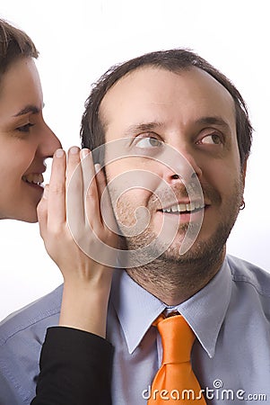 Woman whispering a secret Stock Photo