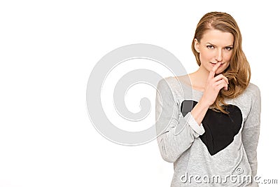 Woman whispering, watching suspiciously. Stock Photo