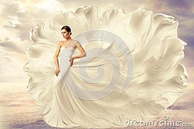 Woman White Dress, Fashion Model in Long Silk Waving Gown, Flying Fluttering Fabric on Wind Stock Photo