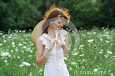 Woman in white dress in a field walk flowers vintage nature Stock Photo