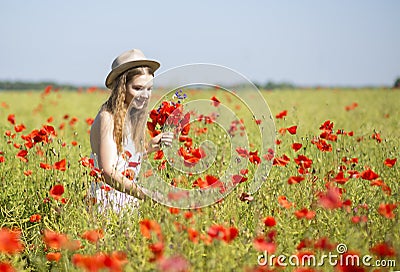 Woman at white dress search beatiful flower Stock Photo