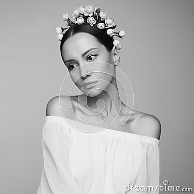 Woman in white greek dress with flowers on her head Stock Photo