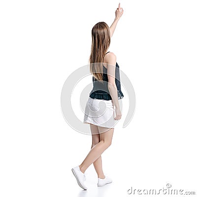 Woman in white skirt and black showing pointing Stock Photo