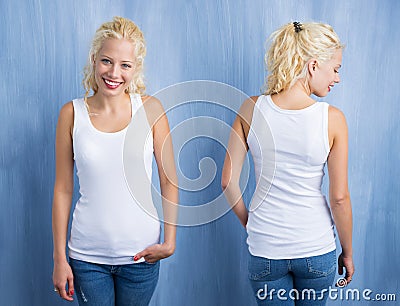 Woman in white tanktop on blue background Stock Photo