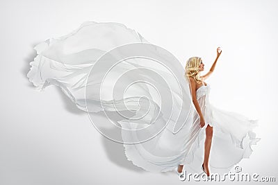 Woman White Waving Dress, Showing Hand Up, Flying Silk Fabric Stock Photo