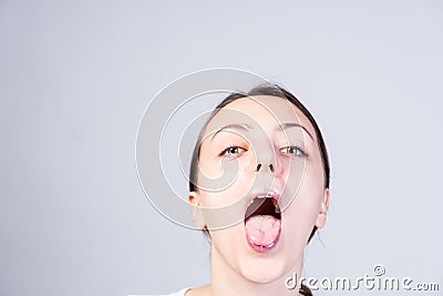 Woman with Wide Open Mouth Looking at Camera Stock Photo