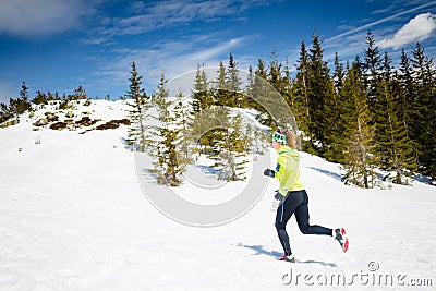 Woman winter running in beautiful inspirational landscape Stock Photo