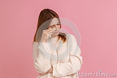 Woman wiping tears crying, feeling desperate hopeless, coping lonely in emotional stress, wearing. Stock Photo