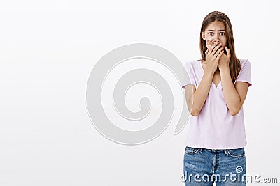 Woman witnessing terrible accident feeling shocked and panicking. Portrait of terrified upset young european female Stock Photo